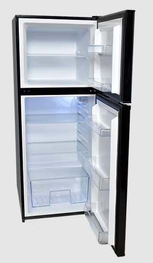 Interior view of Solstice 283L 12V Fridge showing 3 glass shelves and freezer